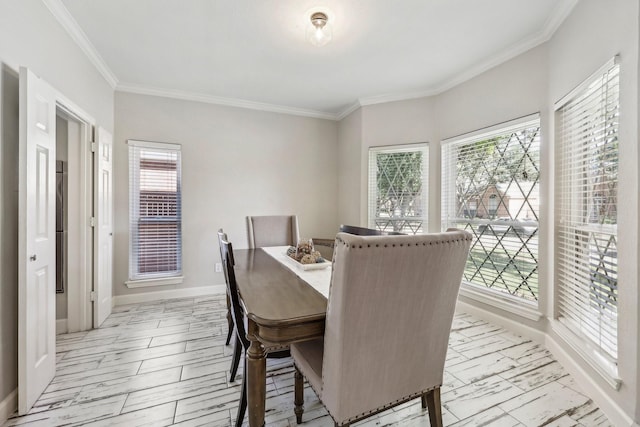 dining area with marble finish floor, crown molding, and baseboards