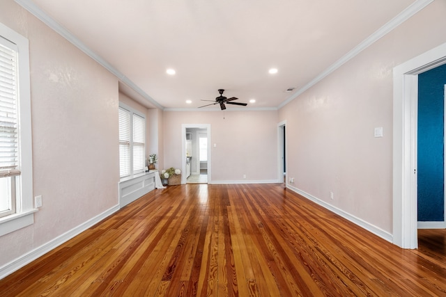 unfurnished living room featuring recessed lighting, wood finished floors, visible vents, baseboards, and ornamental molding