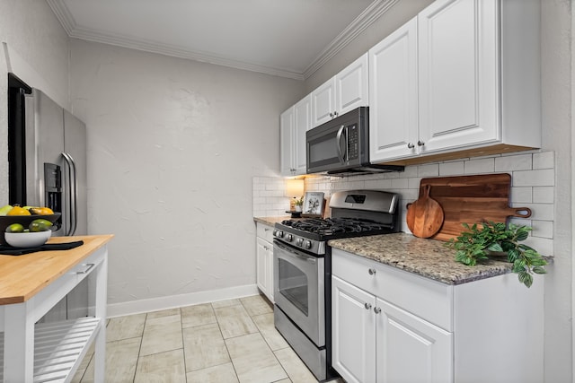 kitchen featuring white cabinets, tasteful backsplash, stainless steel appliances, and crown molding