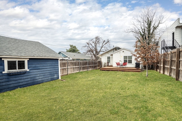 view of yard featuring a fenced backyard and a wooden deck