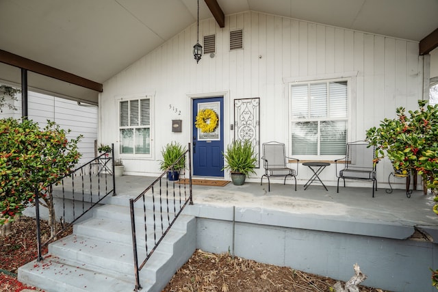 property entrance featuring covered porch