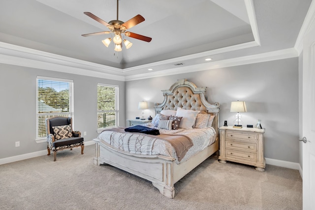 bedroom with light carpet, visible vents, baseboards, and a raised ceiling