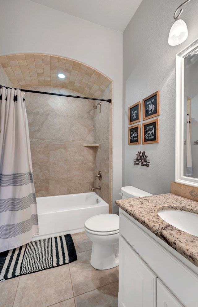 full bathroom with tile patterned flooring, vanity, toilet, and shower / bathtub combination with curtain