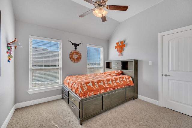 bedroom featuring baseboards, vaulted ceiling, and light colored carpet