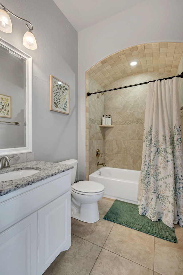 bathroom with toilet, shower / tub combo, tile patterned flooring, and vanity