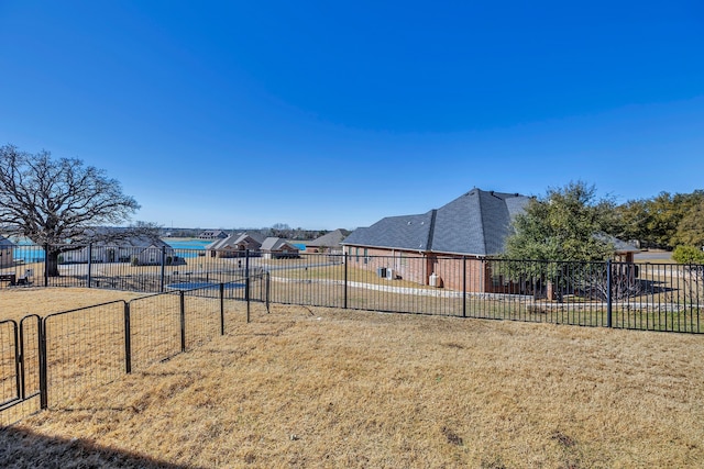 view of yard with a residential view and fence