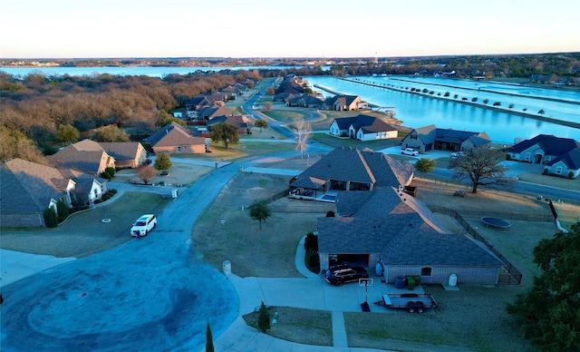 bird's eye view with a water view and a residential view