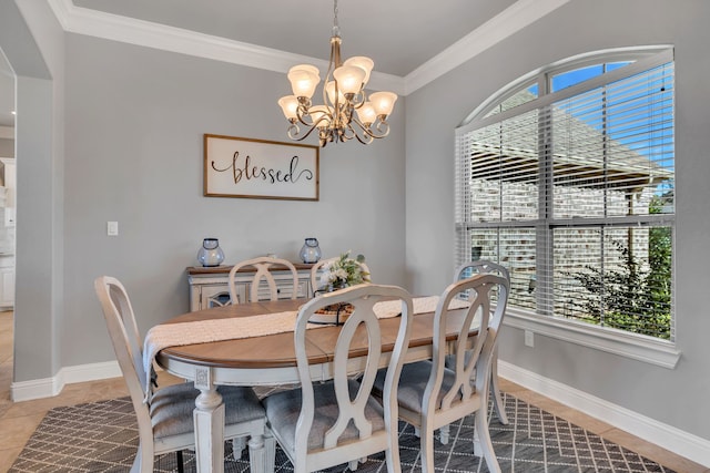 dining area with light tile patterned floors, ornamental molding, an inviting chandelier, and baseboards