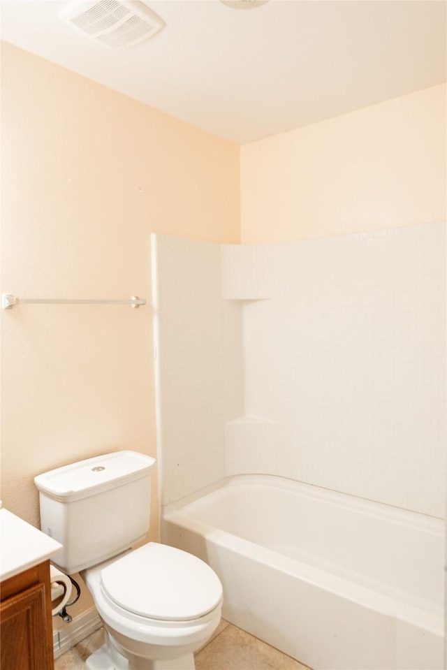 bathroom with visible vents, toilet, washtub / shower combination, vanity, and tile patterned flooring