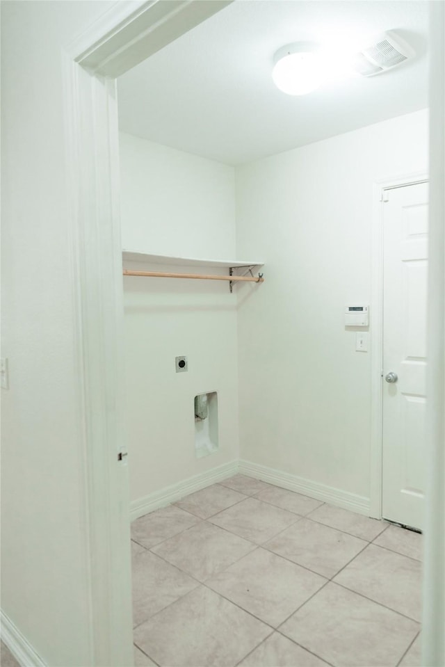 laundry area featuring light tile patterned floors, visible vents, hookup for an electric dryer, laundry area, and baseboards