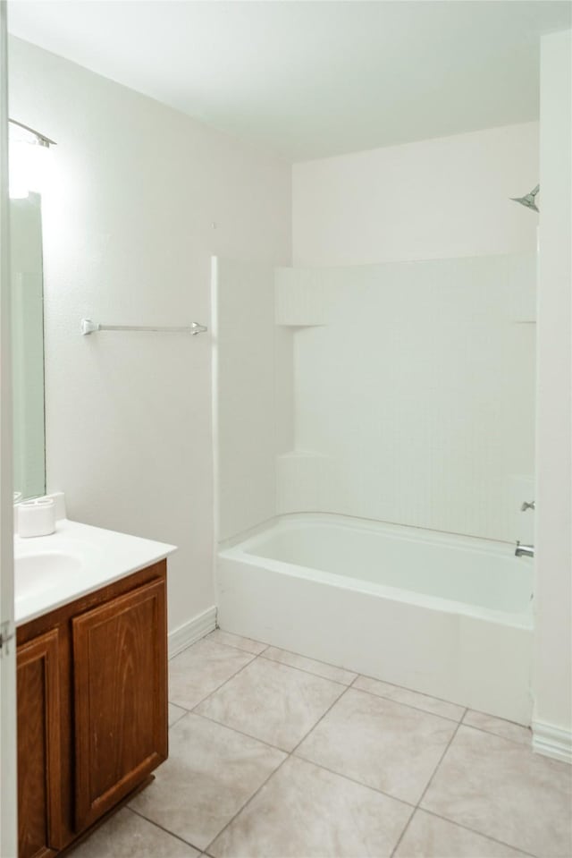 full bathroom with shower / bath combination, vanity, and tile patterned floors