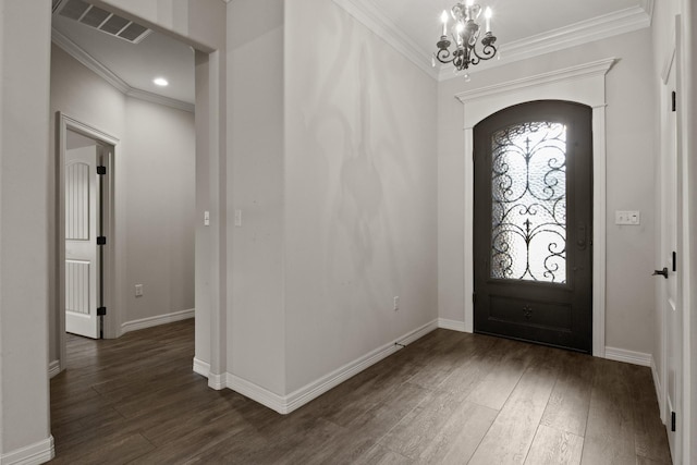 foyer entrance with wood finished floors and crown molding