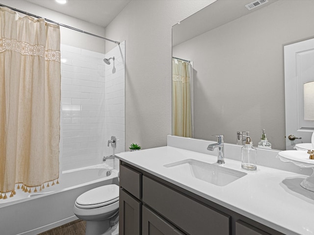 full bathroom featuring visible vents, toilet, wood finished floors, shower / tub combo with curtain, and vanity