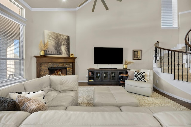 2822 Palmerston Dr, Midlothian, TX 76065 - living area with wood finished floors, ceiling fan, stairs, a high ceiling, and healthy amount of natural light