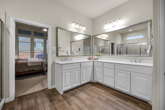 2822 Palmerston Dr, Midlothian, TX 76065 - ensuite bathroom with double vanity, a shower stall, wood finished floors, and ceiling fan