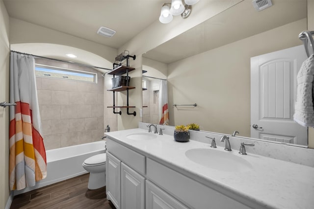 2822 Palmerston Dr, Midlothian, TX 76065 - bathroom featuring double vanity, wood finished floors, and shower / tub combo