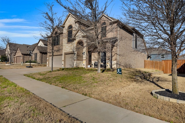 2822 Palmerston Dr, Midlothian, TX 76065 - french provincial home with brick siding, a garage, concrete driveway, and stone siding
