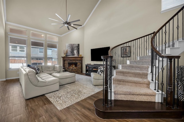 2822 Palmerston Dr, Midlothian, TX 76065 - living room featuring a fireplace, a ceiling fan, stairway, crown molding, and wood finished floors