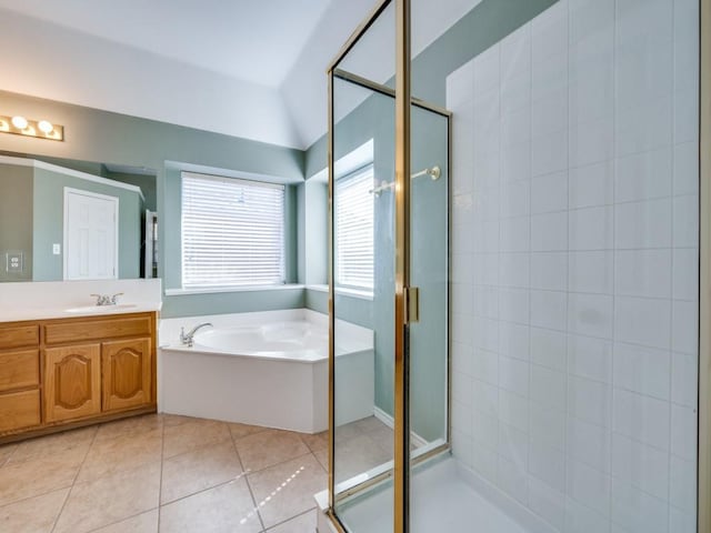 bathroom with a shower stall, a bath, and tile patterned floors