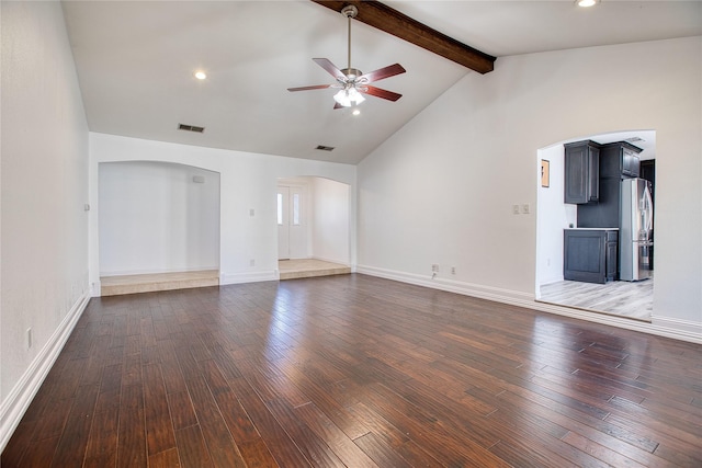 unfurnished living room with arched walkways, lofted ceiling with beams, ceiling fan, hardwood / wood-style flooring, and visible vents