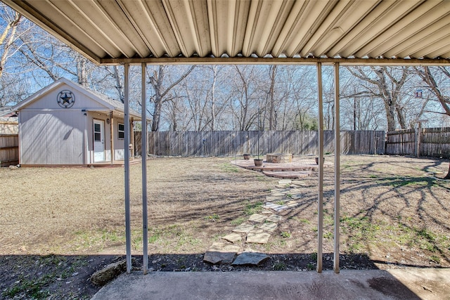 view of yard with an outbuilding and a fenced backyard