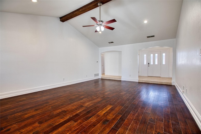 unfurnished living room featuring baseboards, visible vents, arched walkways, lofted ceiling with beams, and dark wood-type flooring