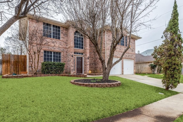 traditional-style home featuring driveway, fence, a front lawn, and brick siding