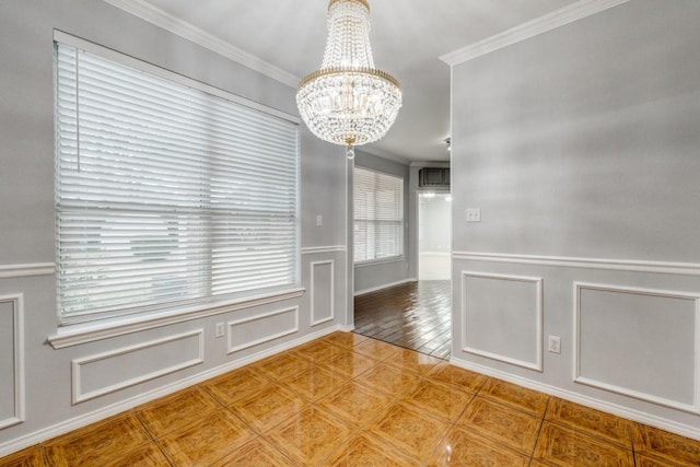 unfurnished dining area with an inviting chandelier, a decorative wall, crown molding, and a wainscoted wall