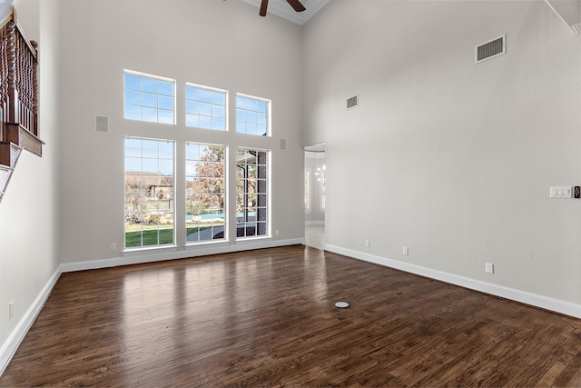 100 Bailee Ct, Forney, TX 75126 - spare room with ceiling fan, dark wood-type flooring, baseboards, and a high ceiling