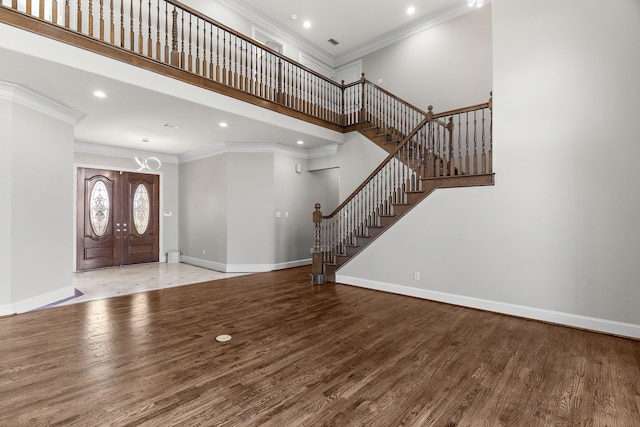 100 Bailee Ct, Forney, TX 75126 - foyer entrance with baseboards, stairs, wood finished floors, ornamental molding, and a towering ceiling