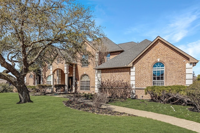 100 Bailee Ct, Forney, TX 75126 - view of front of property with brick siding, a front lawn, and roof with shingles