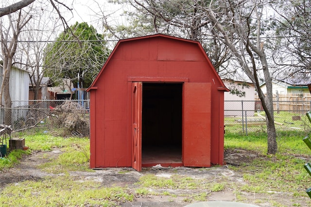 view of shed with fence