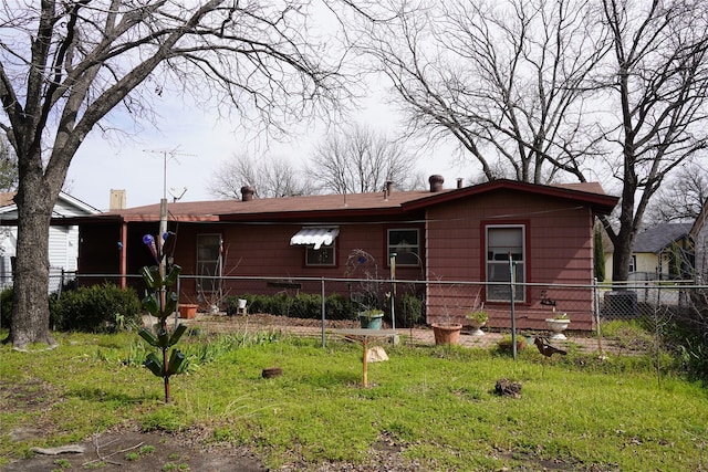 ranch-style home with fence