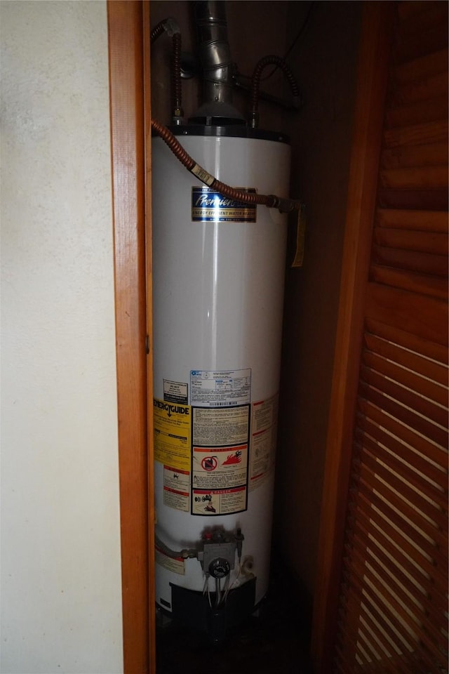 utility room featuring water heater