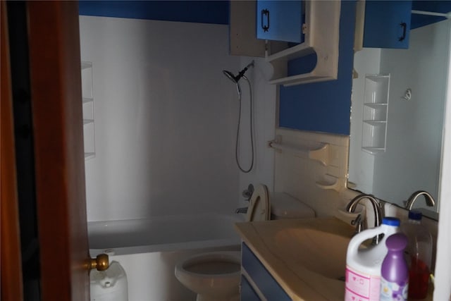 bathroom featuring tub / shower combination, vanity, and toilet