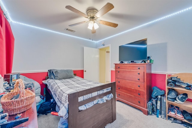 bedroom with ceiling fan, visible vents, and carpet flooring