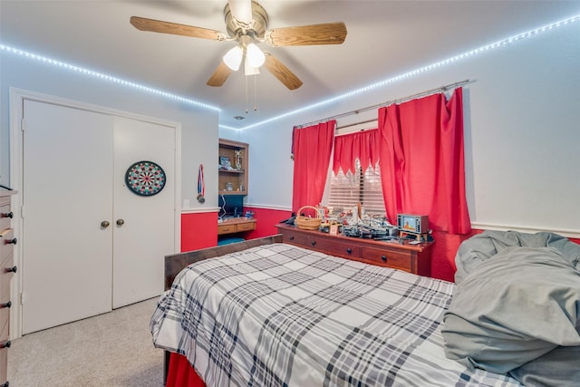 carpeted bedroom with ceiling fan