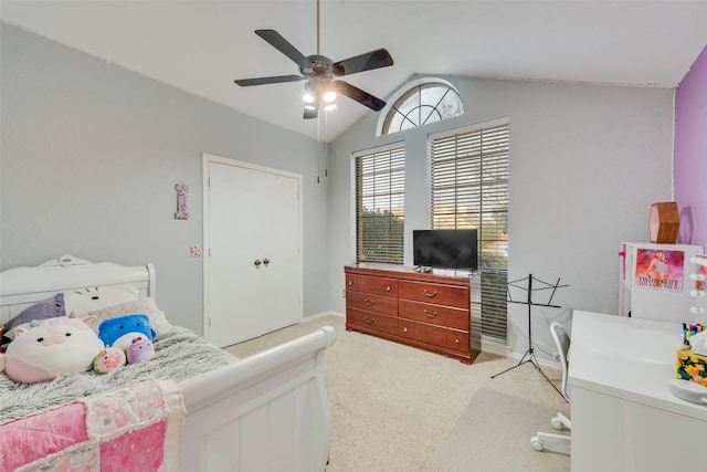 bedroom with a ceiling fan, lofted ceiling, light carpet, and baseboards