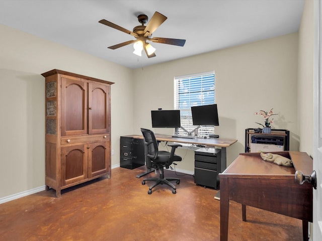 office space with ceiling fan, finished concrete flooring, and baseboards