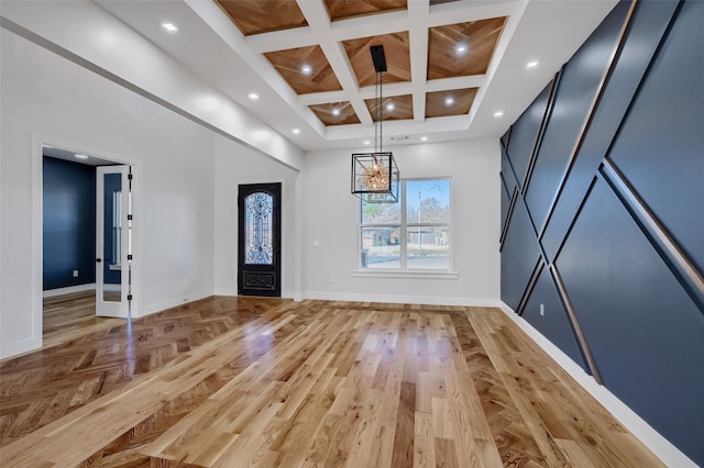 foyer featuring a high ceiling, baseboards, coffered ceiling, and recessed lighting