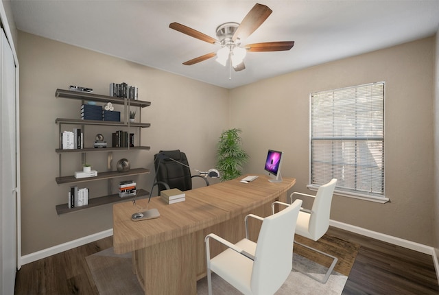 office area with dark wood finished floors, a ceiling fan, and baseboards