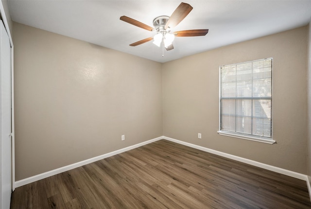 unfurnished room with ceiling fan, baseboards, and wood finished floors