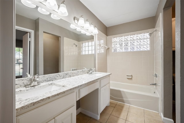 bathroom with shower / washtub combination, a sink, a wealth of natural light, and tile patterned floors