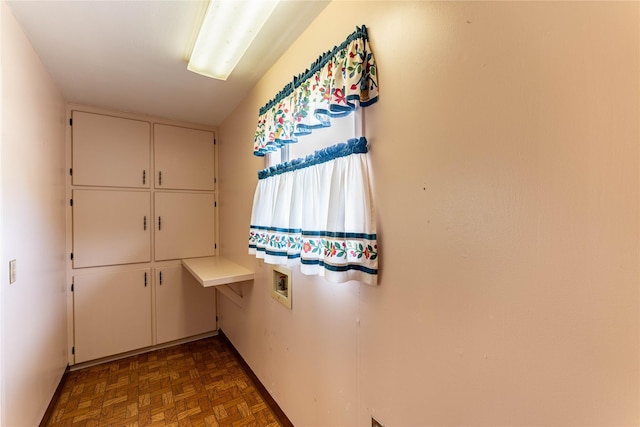 interior space featuring cabinet space and hookup for a washing machine