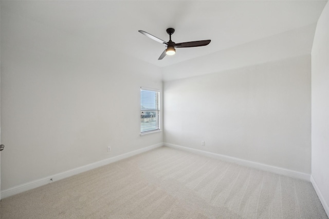 unfurnished room with light carpet, ceiling fan, and baseboards