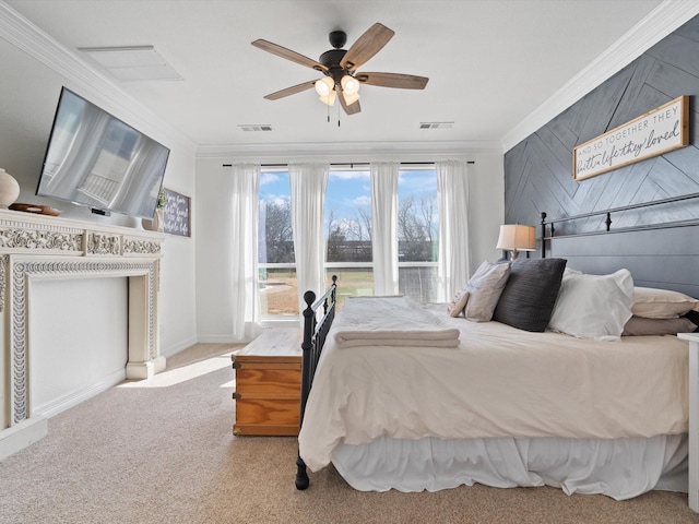 carpeted bedroom featuring ornamental molding, visible vents, and a ceiling fan