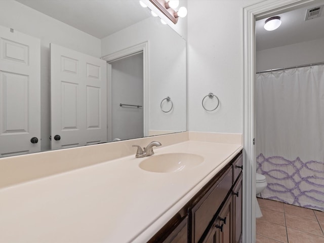 bathroom featuring curtained shower, tile patterned flooring, toilet, visible vents, and vanity