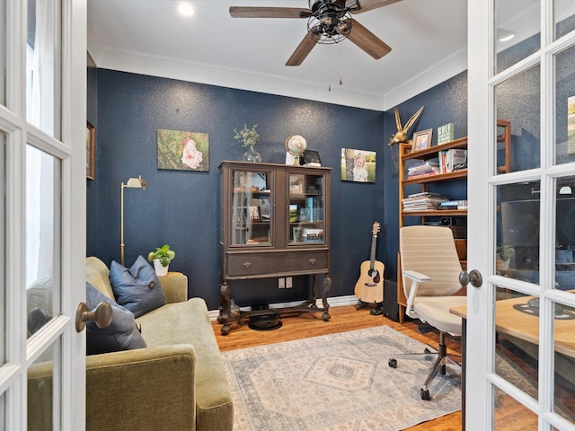 home office featuring french doors, ornamental molding, wood finished floors, and baseboards