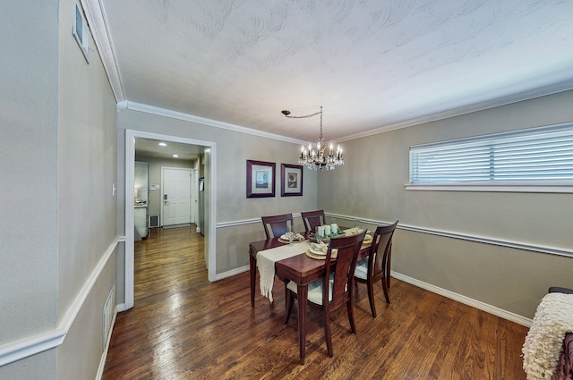 dining area with ornamental molding, a chandelier, baseboards, and wood finished floors