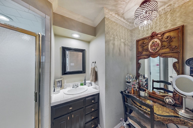 bathroom featuring ornamental molding, vanity, a shower with shower door, and an inviting chandelier